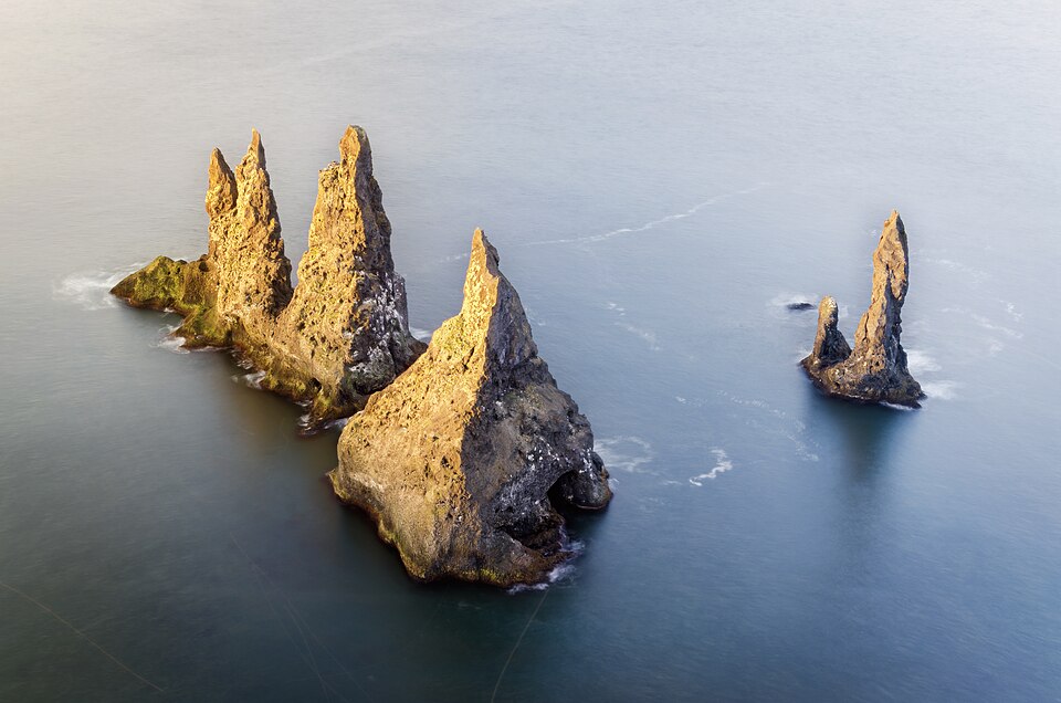 Reynisdrangar sea stacks off the black sand at Vík